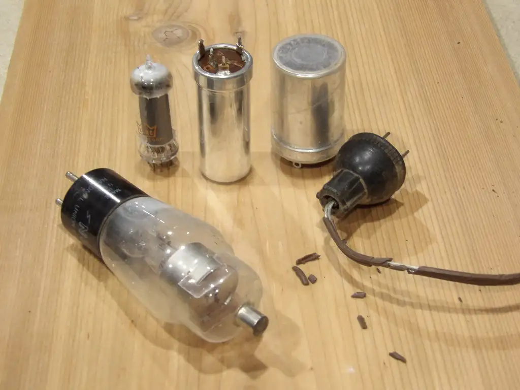 Vintage electronics and old radio equipment on a workbench